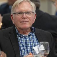 Gentleman looking at camera with pensive expression